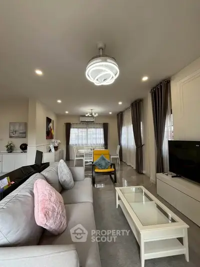 Spacious modern living room with elegant decor and ample natural light