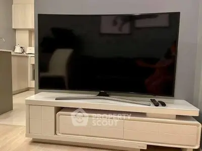 Modern living room with sleek TV and stylish furniture