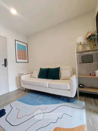 Chic modern living room with stylish decor and cozy sofa, perfect for relaxation.
