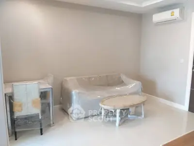 Modern living room with air conditioning and minimalistic furniture