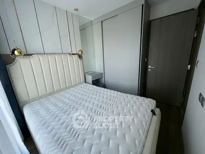 Modern bedroom with stylish headboard and sleek wardrobe design