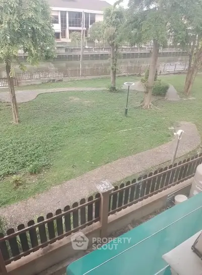 Charming garden view from a residential property, showcasing lush greenery and serene surroundings.