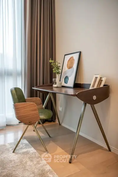 Stylish study nook with modern desk and chair in cozy apartment corner.