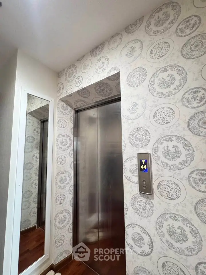 Stylish elevator with elegant wallpaper in modern building