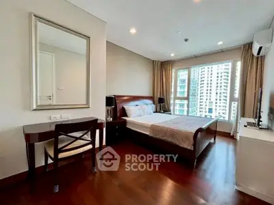 Spacious bedroom with elegant decor and city view in modern apartment