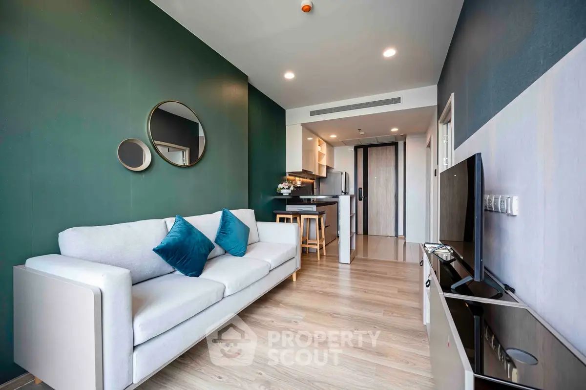 Modern living room with stylish decor and open kitchen layout