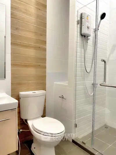 Modern bathroom with sleek shower and wooden accent wall