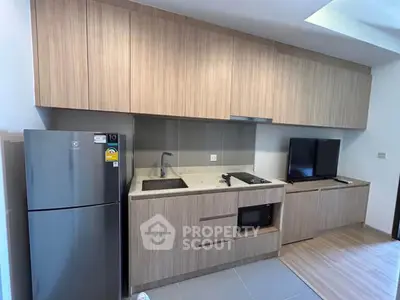 Modern kitchen with sleek cabinetry and integrated appliances