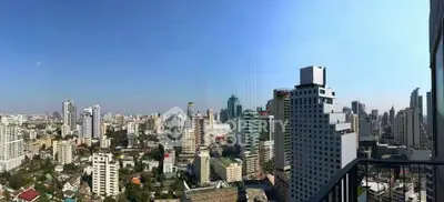 Stunning cityscape view from a high-rise balcony showcasing urban skyline.