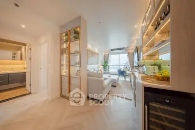 Luxurious open-plan living room with elegant decor and stunning city view.