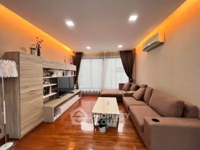 Modern living room with stylish furniture and ambient lighting