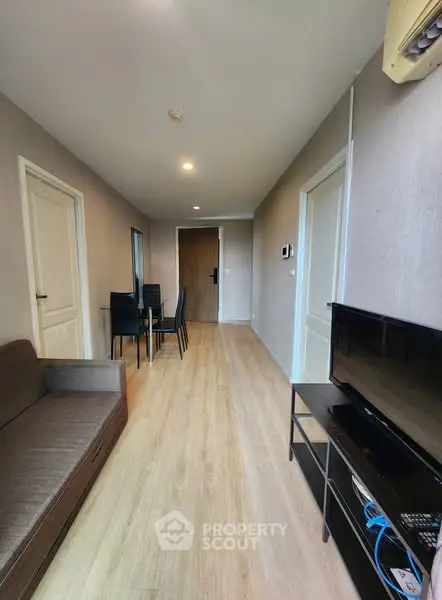 Modern living room with sleek furniture and wooden flooring