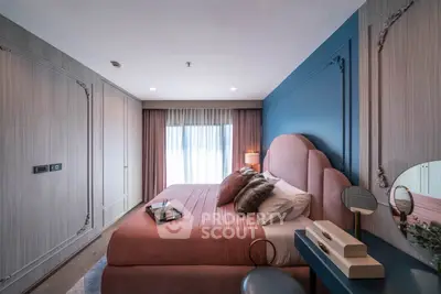 Luxurious bedroom with elegant decor and plush bedding in modern apartment
