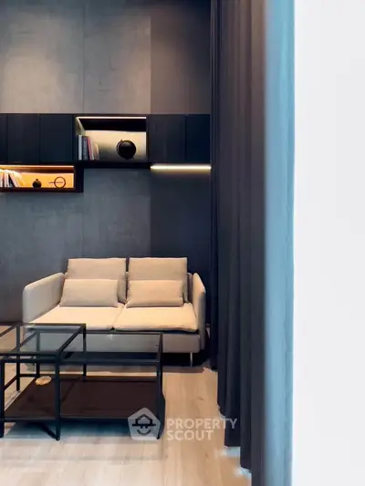 Modern living room with sleek design and cozy sofa, perfect for relaxation and entertainment.
