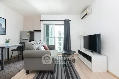 Modern living room with stylish furniture and large window in a contemporary apartment.