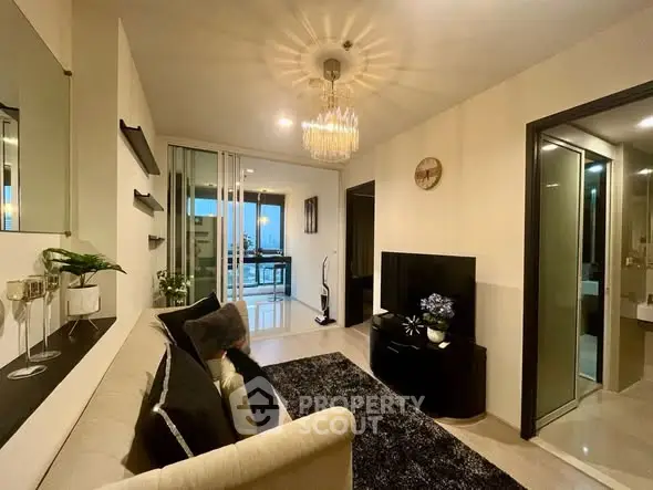 Stylish modern living room with elegant decor and open balcony view