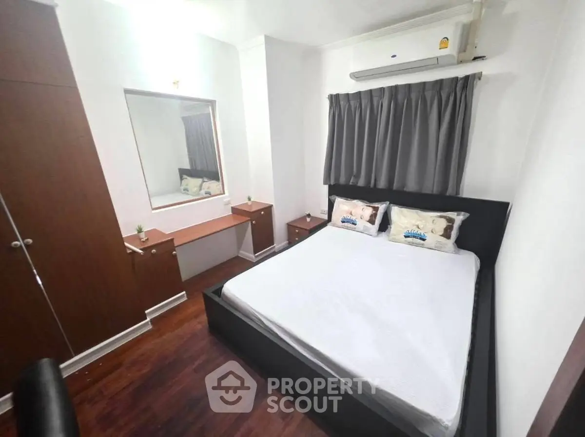 Cozy bedroom with modern furnishings and air conditioning