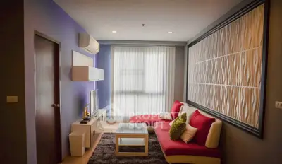 Stylish modern living room with vibrant red sofa and elegant wall decor
