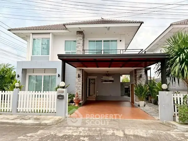 Charming two-story house with modern design and spacious driveway