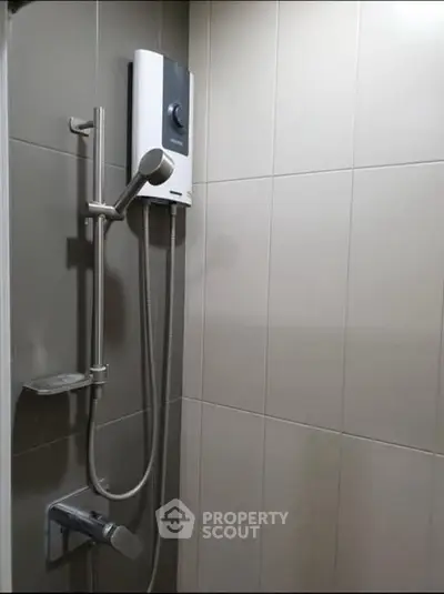 Modern bathroom with sleek shower and water heater