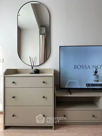 Modern living room with stylish furniture and TV setup
