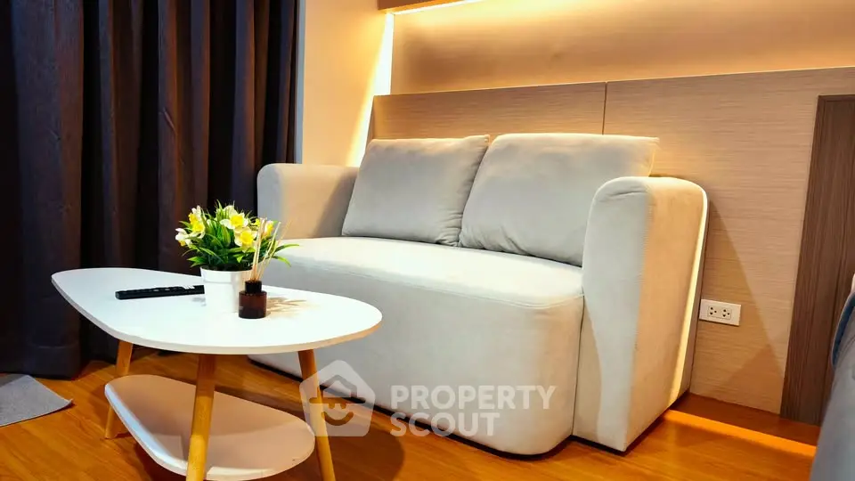 Stylish modern living room with cozy sofa and elegant coffee table