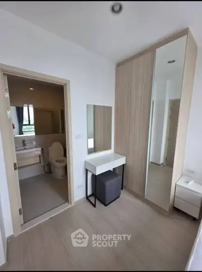 Modern bedroom with ensuite bathroom and stylish wardrobe