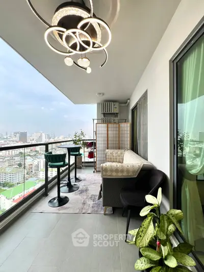 Spacious balcony with city view, modern furniture, and stylish lighting.