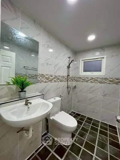 Modern bathroom with sleek tiles and contemporary fixtures