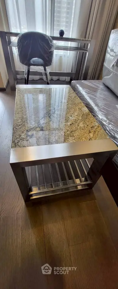 Modern living room with stylish granite coffee table and elegant decor