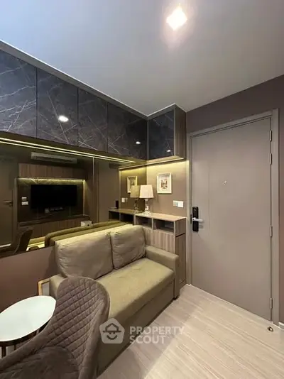 Modern living room with sleek design and cozy seating area