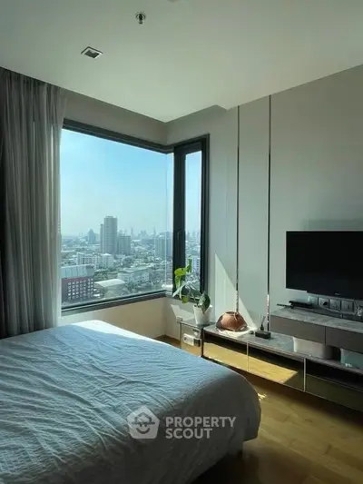Modern bedroom with stunning city view and sleek decor