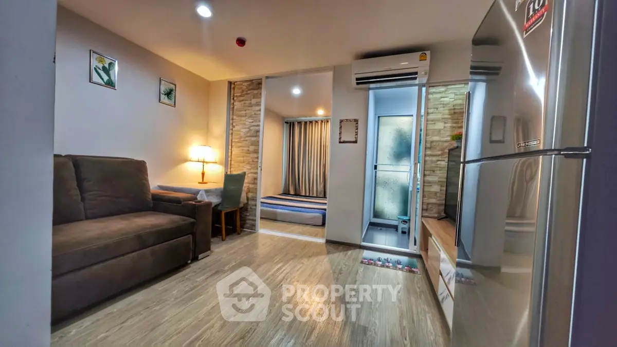 Modern living room with cozy sofa and stylish decor in a contemporary apartment.