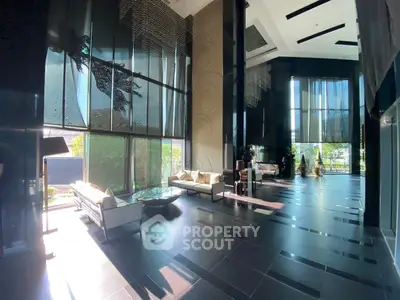 Luxurious modern building lobby with high ceilings and elegant decor