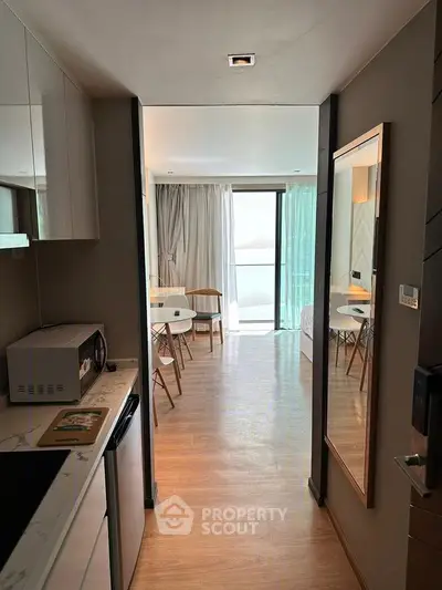 Modern apartment interior with open layout and balcony view