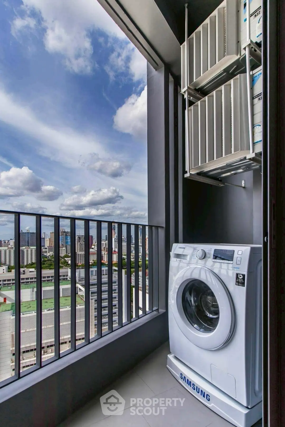 Modern balcony with washing machine and stunning city view