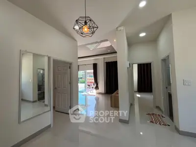 Spacious modern living area with high ceilings and natural light