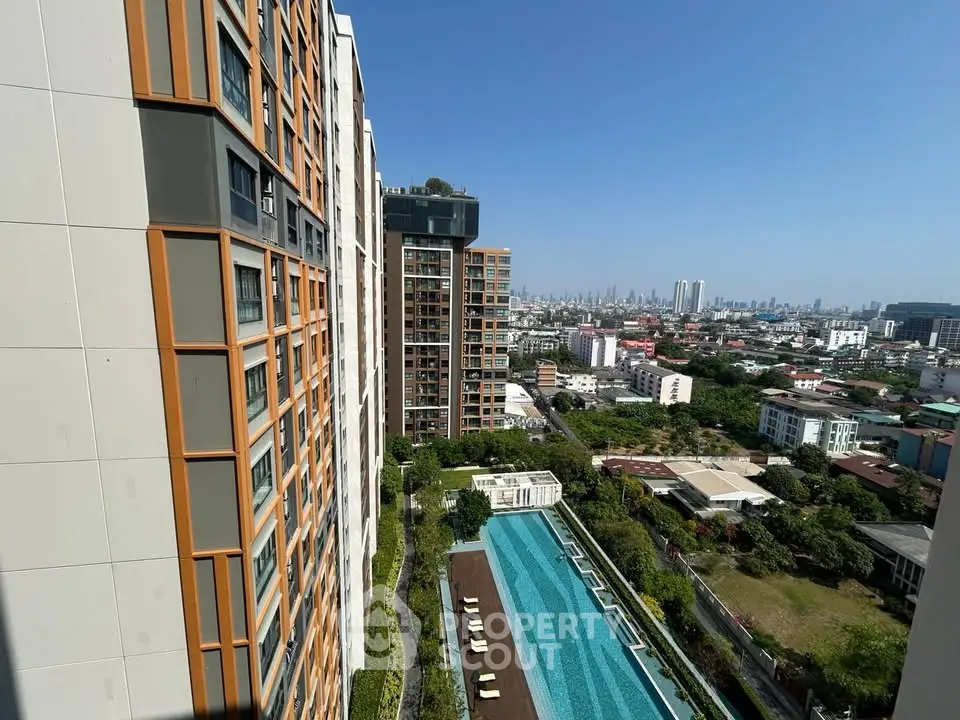 Stunning high-rise apartment with pool and city view, perfect for urban living.