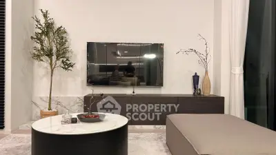 Modern living room with sleek TV setup and stylish decor