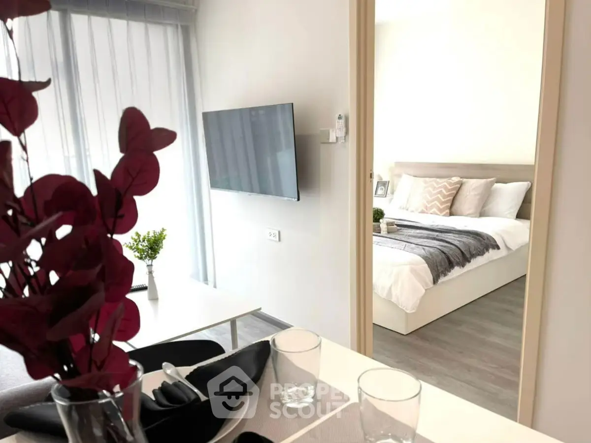 Modern apartment interior with stylish living room and cozy bedroom view