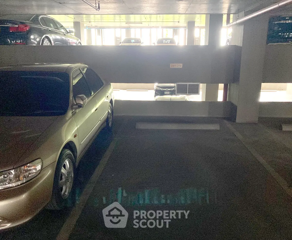 Spacious underground parking area with multiple car spaces available.
