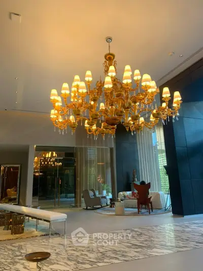 Luxurious living room with grand chandelier and elegant decor