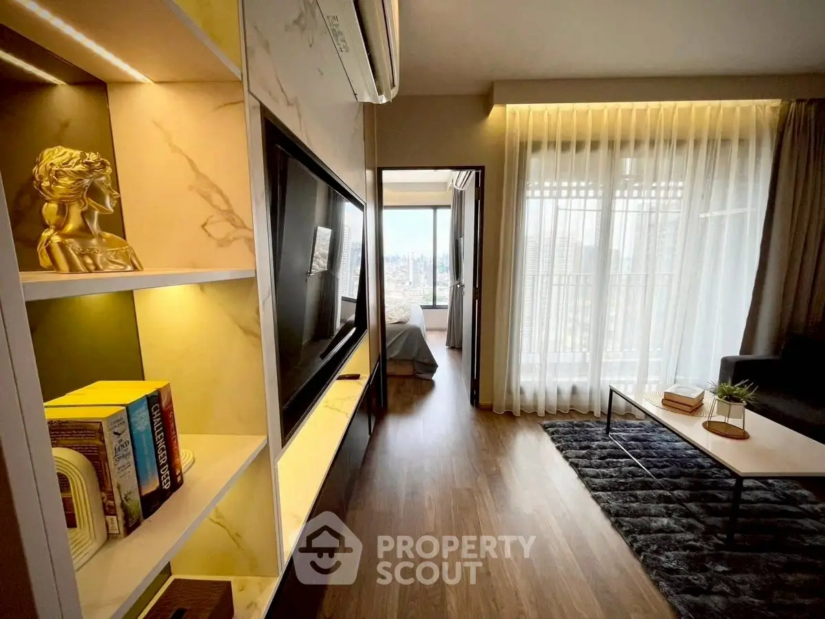Modern living room with elegant decor and city view, featuring a cozy seating area and stylish shelving.