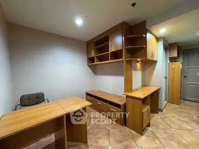 Modern study room with wooden furniture and ample storage space