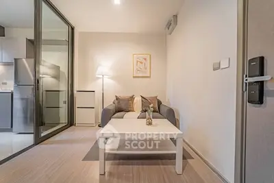 Modern living room with cozy sofa and stylish decor in a contemporary apartment.