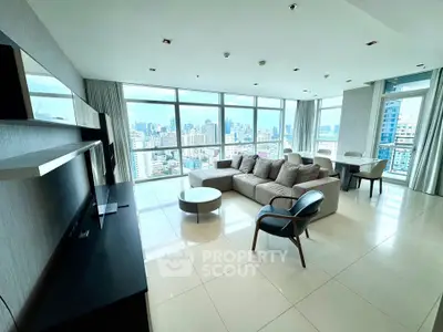 Spacious modern living room with panoramic city views and elegant furnishings.