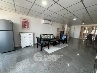 Spacious living room with modern furniture and open layout