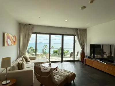 Spacious living room with stunning ocean view and modern decor