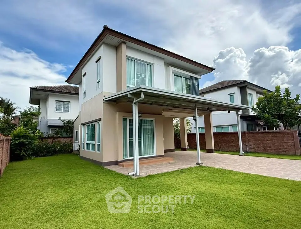 Modern two-story house with spacious lawn and covered patio in suburban neighborhood.