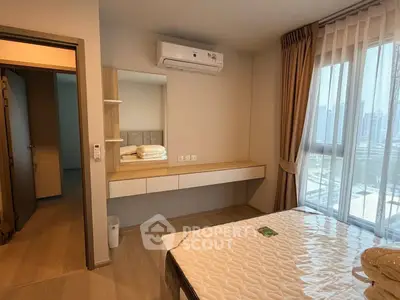 Modern bedroom with large window and city view, featuring air conditioning and stylish decor.